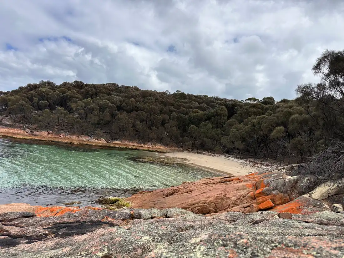 Honeymoon Bay with orange lichen granite and turquoise water