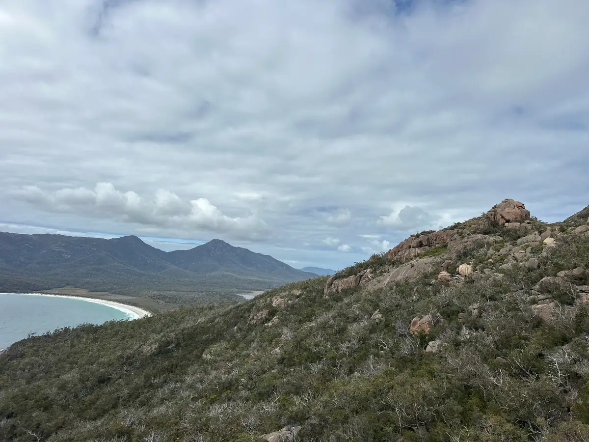 Wineglass Bay and Mount Amos ridge with pink granite boulders
