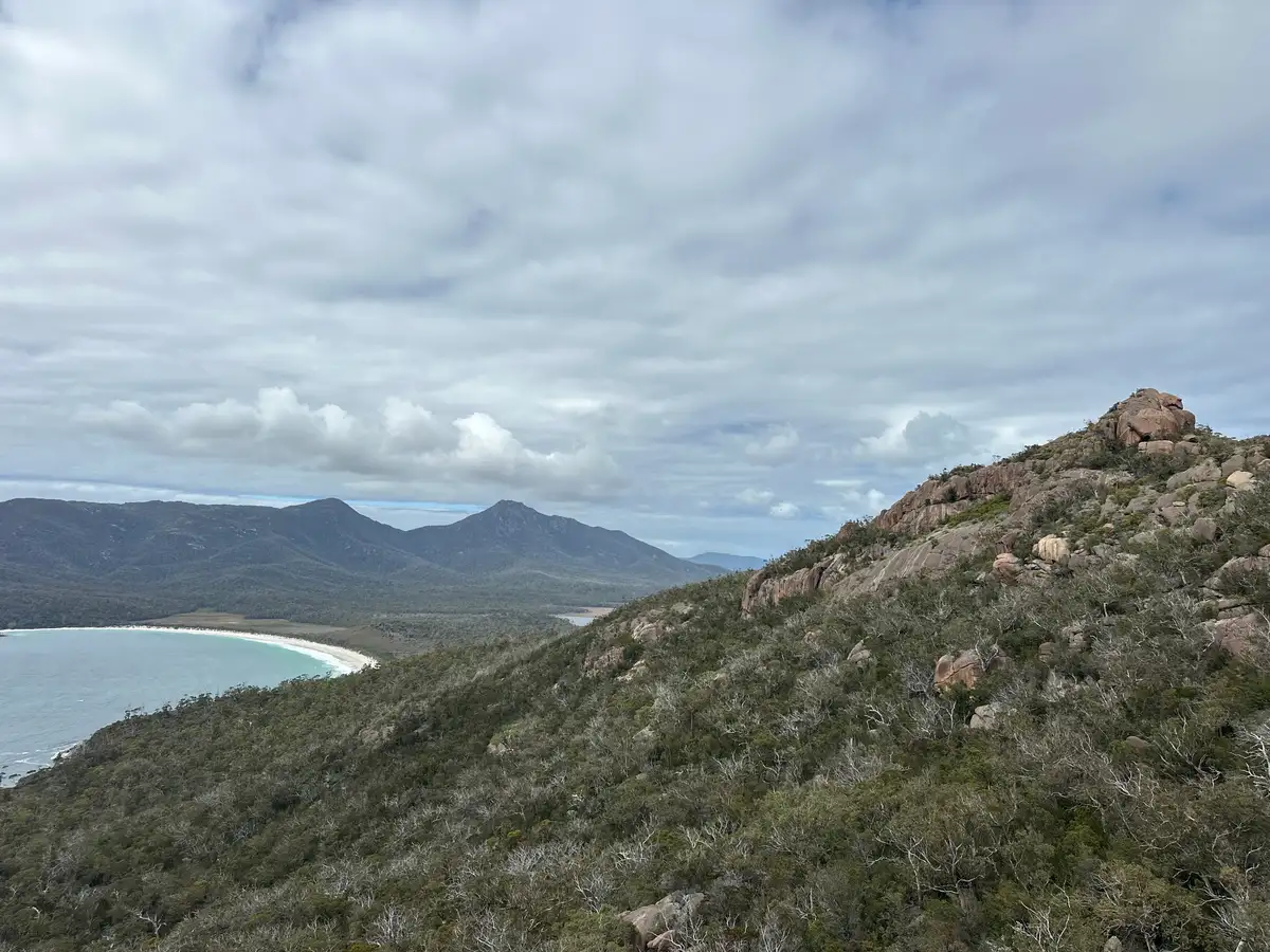 Wineglass Bay coastline with Mount Amos summit and coastal scrubland